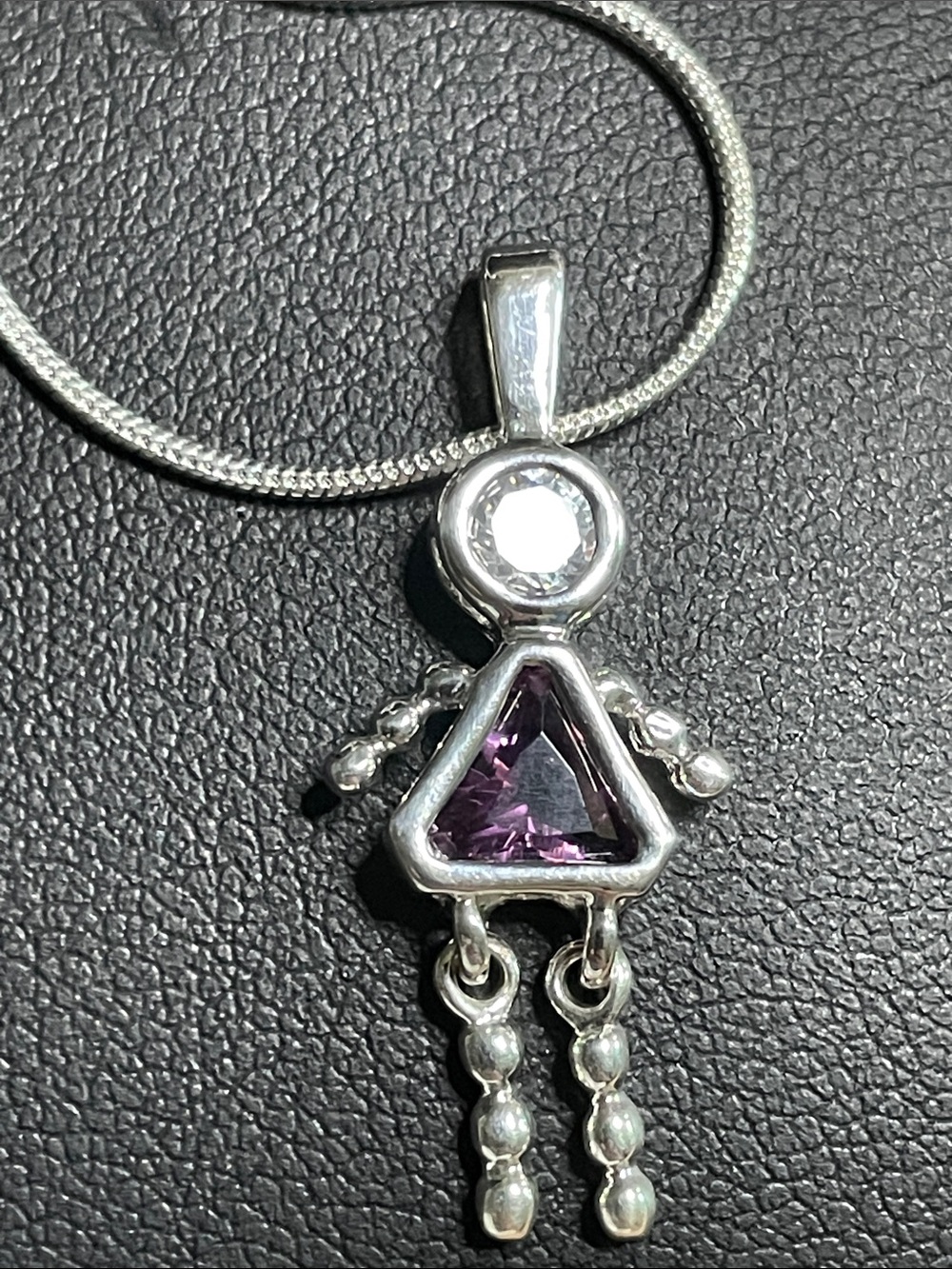 Vintage Collectible Girl Cz/Amethyst  the chain is 16”silver plated. Very good !